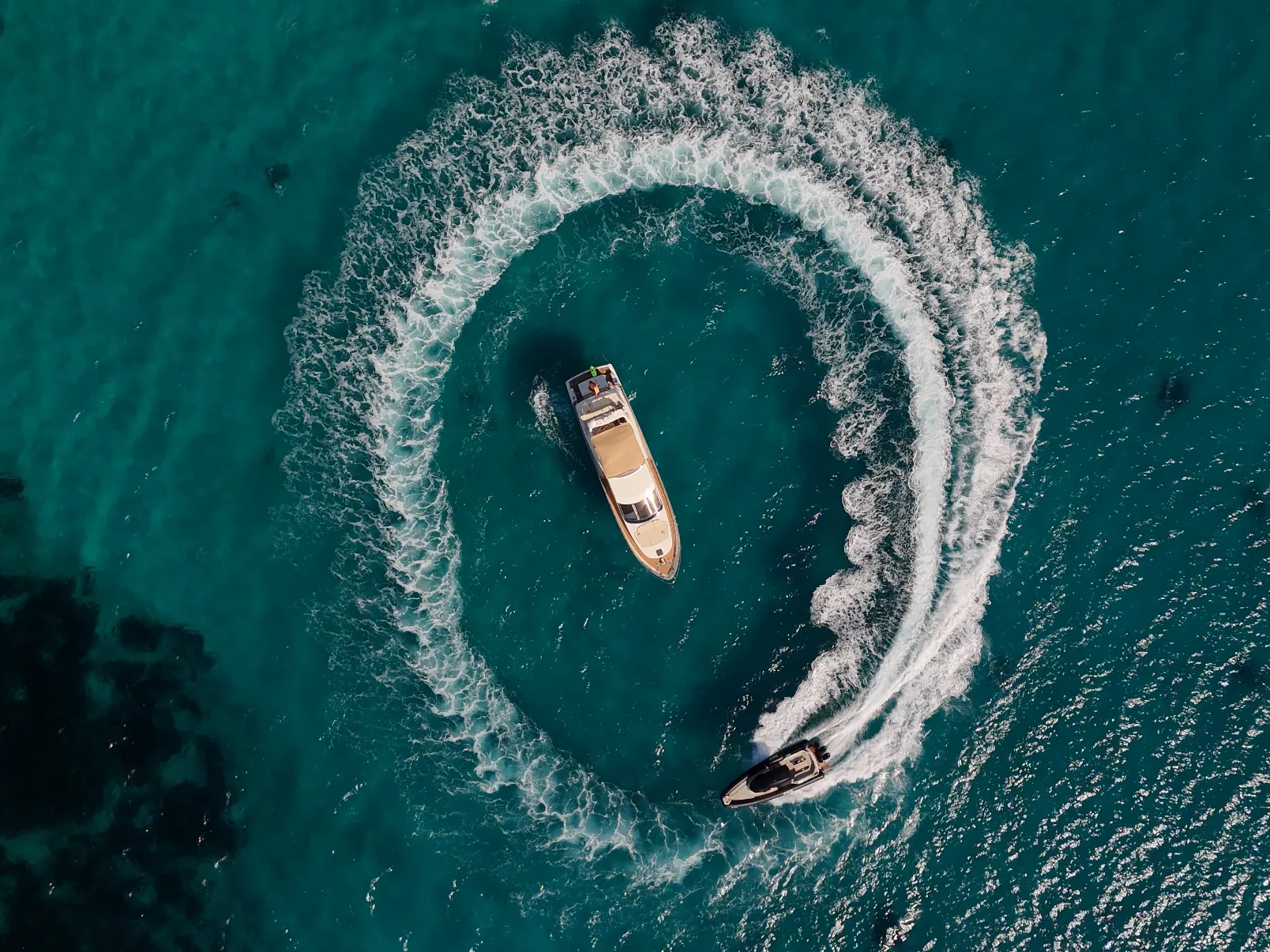 Aerial view of Lady Elbaum cruising over turquoise water