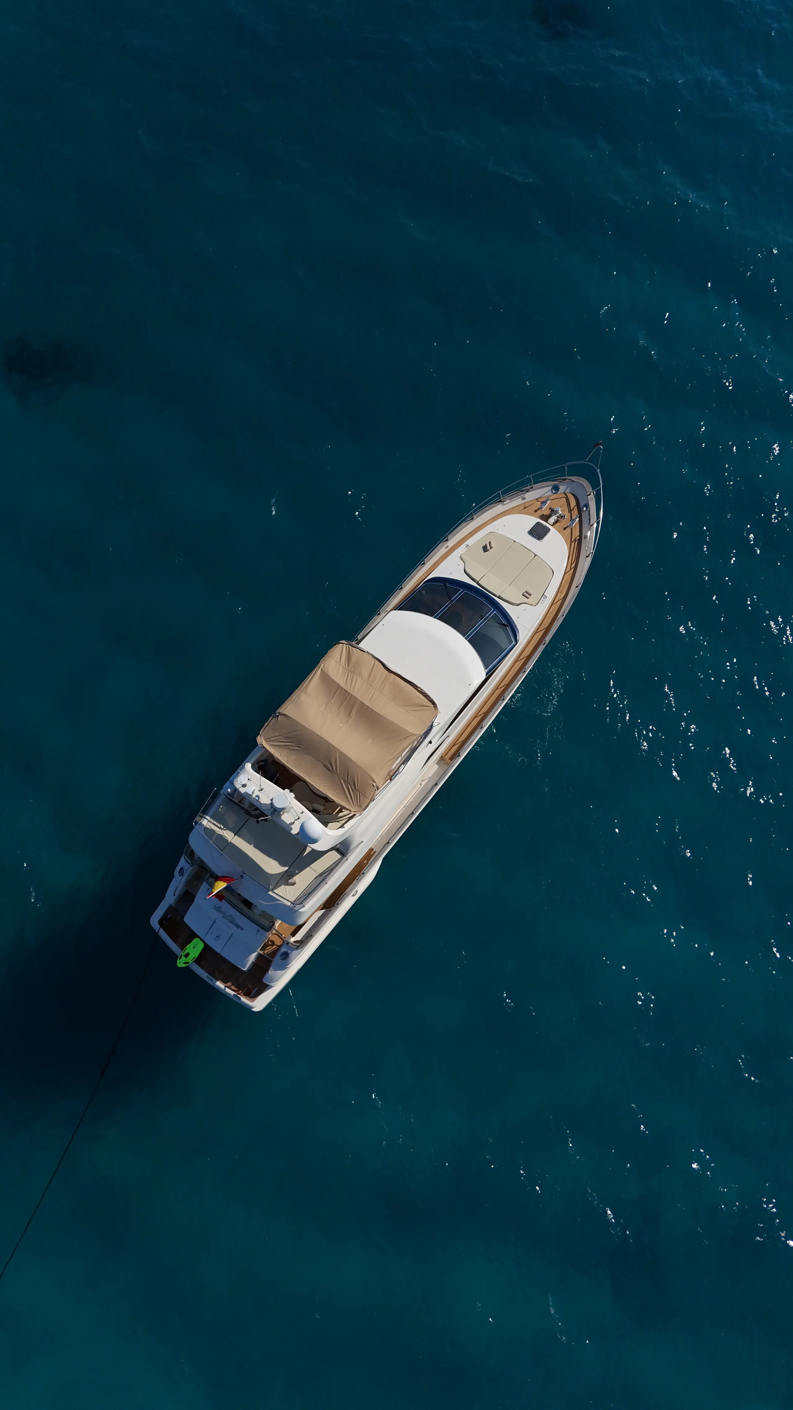 Overhead aerial of Lady Elbaum at anchor in a Mallorca cove