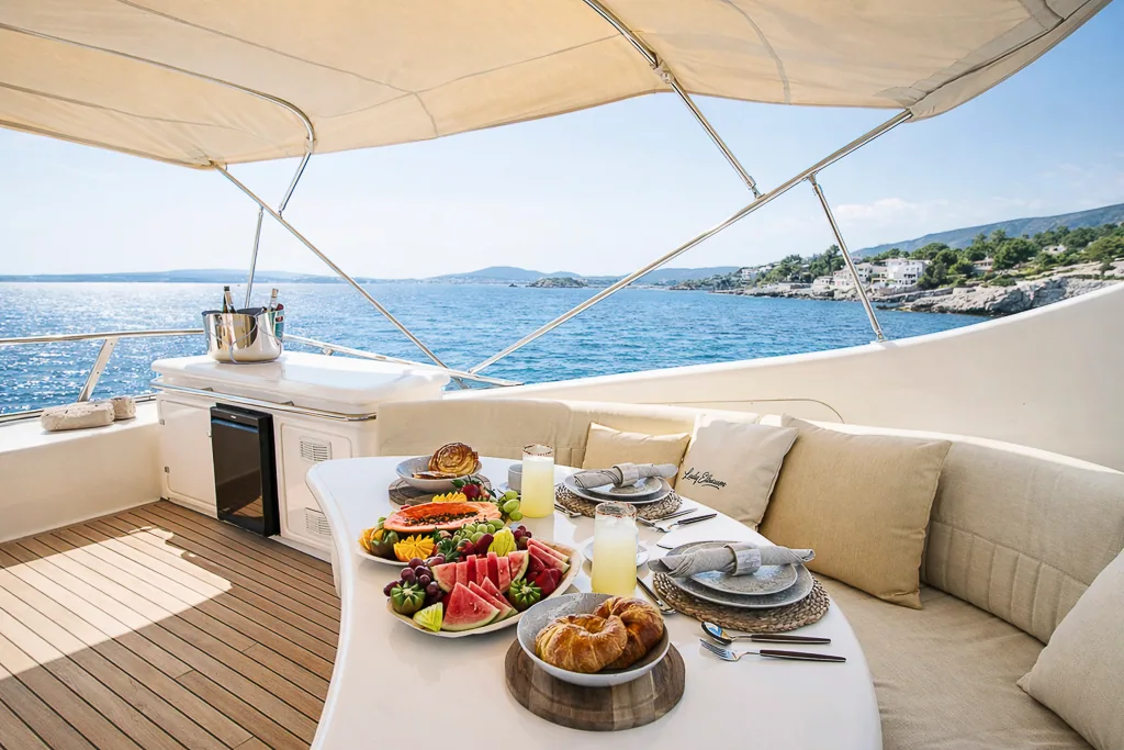 Breakfast spread on the aft deck with Mediterranean view