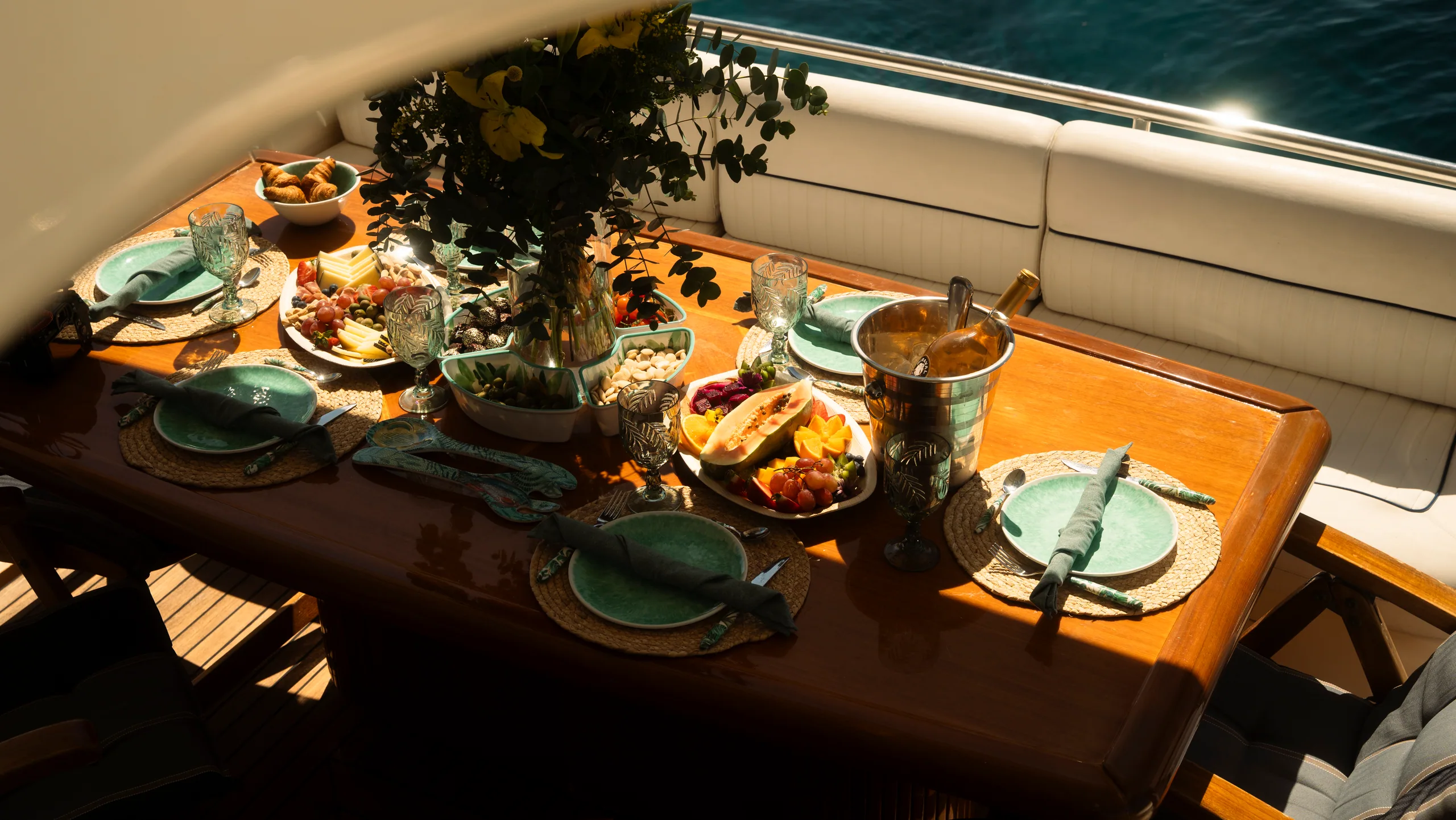 Al fresco dinner service aboard Lady Elbaum under the Mediterranean sun